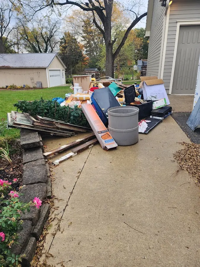 Dumpster being loaded with debris for 3 Yard Dumpster Rental in Ambler